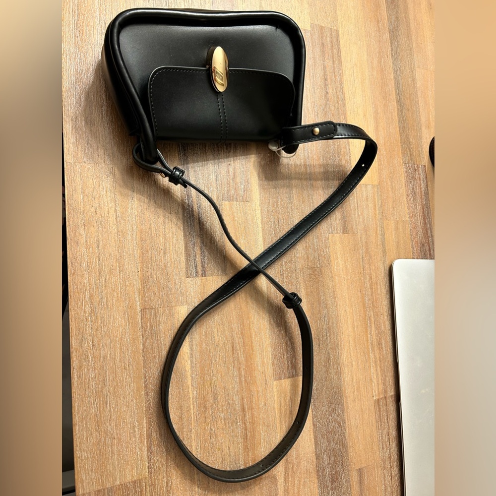 Black mini purse. Gold hardware. Never used.